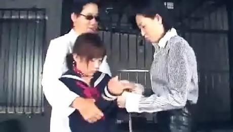 The two lesbian Japanese guards bring a poor innocent girl.