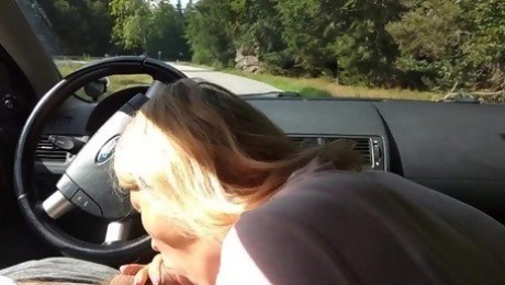 Milf sucking dick on the parking by the public road. Public cock sucking and cumshot