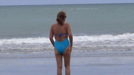 My 58-year-old Latin wife on the beach, shows off & masturbates in front of her stepson