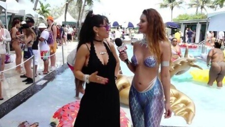 Porn Stars interviewed by Naked News reporter in mermaid body paint at Xbiz Miami poolside
